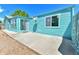 Backyard featuring a blue house and a gravel patio at 1500 S Wolcott Ct, Denver, CO 80219