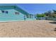Large backyard with a low-maintenance ground cover and a charming blue exterior at 1500 S Wolcott Ct, Denver, CO 80219