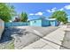 Large backyard with a blue shed and a large parking pad at 1500 S Wolcott Ct, Denver, CO 80219
