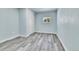 Cozy bedroom with light grey wood-look floors and closet at 1500 S Wolcott Ct, Denver, CO 80219