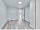 Bedroom with light grey wood-look floors and a skylight at 1500 S Wolcott Ct, Denver, CO 80219