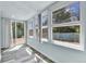 Sun room filled with natural light, featuring large windows and access to the backyard at 1500 S Wolcott Ct, Denver, CO 80219