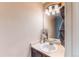 Bathroom featuring a vanity with a large mirror at 4969 Thorndike Ave, Castle Rock, CO 80104