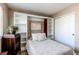 Bedroom featuring built in storage shelves and closet with sliding doors at 4969 Thorndike Ave, Castle Rock, CO 80104