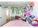 Bedroom with a plush bed and decor, and a doorway leading to the second floor hallway at 4969 Thorndike Ave, Castle Rock, CO 80104