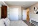 Bedroom featuring built in storage shelves and closet with sliding doors at 4969 Thorndike Ave, Castle Rock, CO 80104