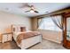Bedroom with plush bed, a window with light-filtering blinds, and a ceiling fan with lighting at 4969 Thorndike Ave, Castle Rock, CO 80104