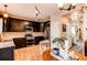 Modern kitchen with dark wood cabinets, stainless steel appliances, and light wood floors at 4969 Thorndike Ave, Castle Rock, CO 80104