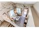 Airy living room with a vaulted ceiling, decorative vines, large windows, and comfortable seating at 4969 Thorndike Ave, Castle Rock, CO 80104