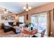 Inviting living area that features a dining area and a comfy sectional sofa with access to an outside patio at 4969 Thorndike Ave, Castle Rock, CO 80104