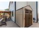 Outdoor storage shed providing additional space for tools and equipment, next to the patio at 4969 Thorndike Ave, Castle Rock, CO 80104