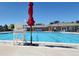 Community swimming pool with clear blue water, perfect for summer recreation and relaxation at 4969 Thorndike Ave, Castle Rock, CO 80104