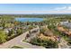 An aerial view features a home with a large pond and city skyline, showcasing its prime location at 10970 W Florida Ave # 225, Lakewood, CO 80232