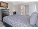 Comfortable bedroom featuring a TV and gray walls at 10970 W Florida Ave # 225, Lakewood, CO 80232