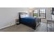 Bedroom offering natural light through windows and carpeted floors at 10970 W Florida Ave # 225, Lakewood, CO 80232