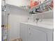 A well-organized laundry room with a washer and dryer at 10970 W Florida Ave # 225, Lakewood, CO 80232
