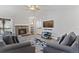 Cozy living room featuring a stone fireplace and comfortable seating at 10970 W Florida Ave # 225, Lakewood, CO 80232