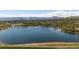 Capture of a serene pond with mountains in the background, perfect for nature lovers and scenic views at 10970 W Florida Ave # 225, Lakewood, CO 80232