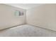 Bright bedroom with neutral walls and carpet features a window with natural light at 331 Wright St # 108, Lakewood, CO 80228