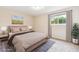 Stylishly staged bedroom showcasing soft colors, decor and natural light at 331 Wright St # 108, Lakewood, CO 80228