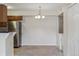Cozy dining area with space for laundry, adjacent to the kitchen at 331 Wright St # 108, Lakewood, CO 80228