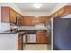 Compact kitchen with stainless steel appliances and dark countertops at 331 Wright St # 108, Lakewood, CO 80228