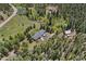 Expansive property featuring a well-maintained home, barn, serene pond, and picturesque views at 27436 Kennedy Gulch Rd, Conifer, CO 80433
