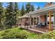 Inviting brick home with outdoor deck areas and mature landscaping at 27436 Kennedy Gulch Rd, Conifer, CO 80433