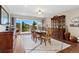 Elegant dining room with mountain views, a dark wood table, and built-in china cabinet at 27436 Kennedy Gulch Rd, Conifer, CO 80433