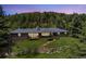 Charming single Gathering home with brick and stone exterior features sprawling lawns at 27436 Kennedy Gulch Rd, Conifer, CO 80433
