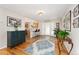 Charming foyer featuring hardwood floors with easy access to both the kitchen and front entry at 27436 Kennedy Gulch Rd, Conifer, CO 80433