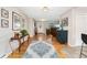Bright and airy foyer featuring hardwood floors and views into the living area at 27436 Kennedy Gulch Rd, Conifer, CO 80433