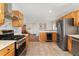 Spacious kitchen with stainless steel appliances, wood cabinets, and a built-in wine cooler at 27436 Kennedy Gulch Rd, Conifer, CO 80433