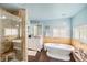 Stylish bathroom with a soaking tub, shower, and modern vanity at 401 N Columbine St, Golden, CO 80403