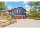 Charming two-story home with a well-maintained driveway and landscaped yard at 401 N Columbine St, Golden, CO 80403