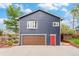 Two-story home featuring a garage and a red front door at 401 N Columbine St, Golden, CO 80403