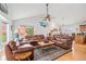 Bright living room featuring vaulted ceilings and a fireplace at 401 N Columbine St, Golden, CO 80403