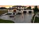 Stunning two-story home with a three-car garage and circular driveway, professionally landscaped at sunset at 2495 Red Hawk Pl, Broomfield, CO 80023