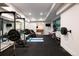 Fully-equipped home gym featuring workout equipment and a mirrored wall for fitness enthusiasts at 2495 Red Hawk Pl, Broomfield, CO 80023