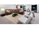 Spacious living room with comfortable seating, a modern rug, and lots of natural light at 2495 Red Hawk Pl, Broomfield, CO 80023