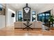 Spacious living room featuring a modern fireplace, high ceilings, hardwood floors, and large sliding doors to the yard at 2495 Red Hawk Pl, Broomfield, CO 80023