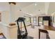 Spacious basement with good lighting, a treadmill, and a table, perfect for entertaining at 6663 S Prescott Way, Littleton, CO 80120