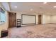 Finished basement space with projector screen and room for versatile activities at 6663 S Prescott Way, Littleton, CO 80120