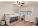 Bedroom with a bunk bed, nice window view, and neutral colored carpet at 6663 S Prescott Way, Littleton, CO 80120