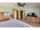 Bedroom with a ceiling fan, nice dresser, and a view looking out to the hallway at 6663 S Prescott Way, Littleton, CO 80120