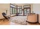 Bright living room featuring a cozy seating area, natural hardwood flooring, and an abundance of natural light at 6663 S Prescott Way, Littleton, CO 80120