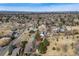Aerial neighborhood view with city skyline in the distance, indicating location and nearby amenities at 1579 W Briarwood Ave, Littleton, CO 80120