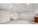 Finished basement with neutral walls and carpet, offering versatility at 1579 W Briarwood Ave, Littleton, CO 80120
