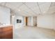 Spacious finished basement area perfect for recreation, featuring neutral walls and flooring at 1579 W Briarwood Ave, Littleton, CO 80120