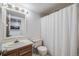 Traditional full bathroom with shower and tub, vanity and medicine cabinet at 1579 W Briarwood Ave, Littleton, CO 80120